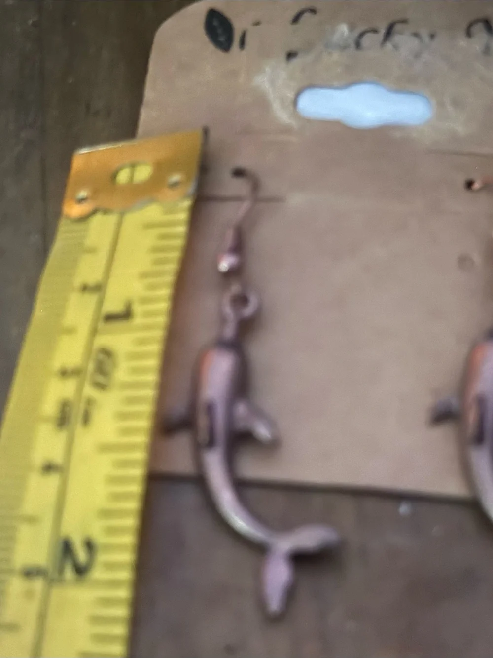 Copper tone dolphin dangle earrings